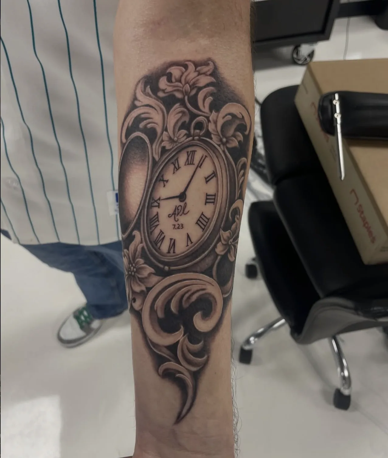 Ornate pocket watch tattoo on forearm